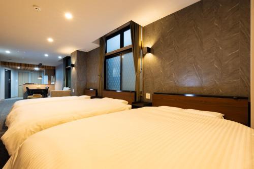 Ένα ή περισσότερα κρεβάτια σε δωμάτιο στο GANADAN Planetarium - Vacation STAY 52394v