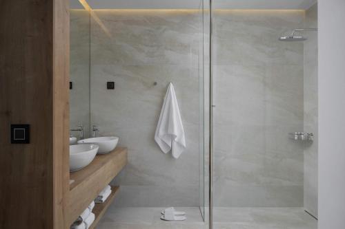 a bathroom with a shower and a sink at 5-Star Villa Calma II with Heated Pool & Jacuzzi Oasis in Starigrad-Paklenica