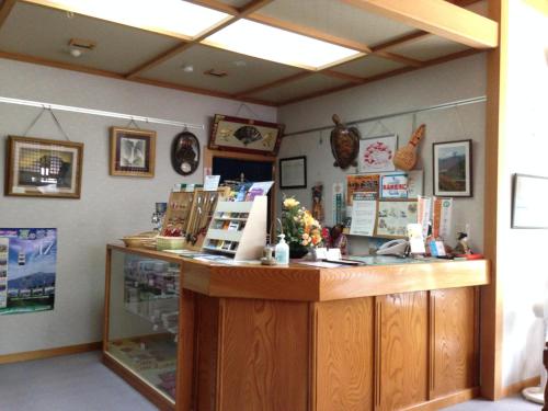 a shop with a counter with a cash register at Ryokan Tanaka in Takayama