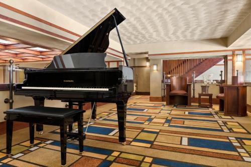 a piano in the lobby of a hotel at The Historic Park Inn Hotel in Mason City