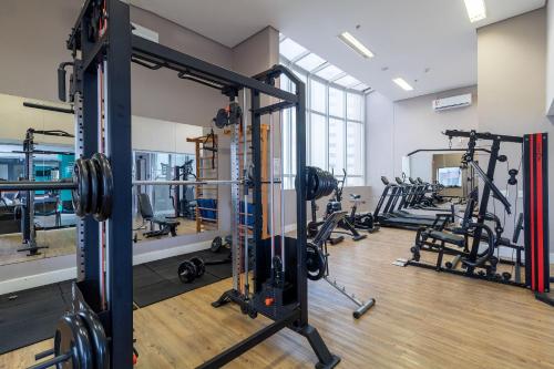 a gym with several treadmills and machines at LFlats no Hotel Stella Vega (EX-Mercury Ibirapuera) in Sao Paulo