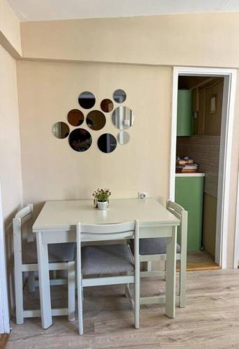 a white table and chairs in a room at Villa Lenka Sokobanja in Soko Banja
