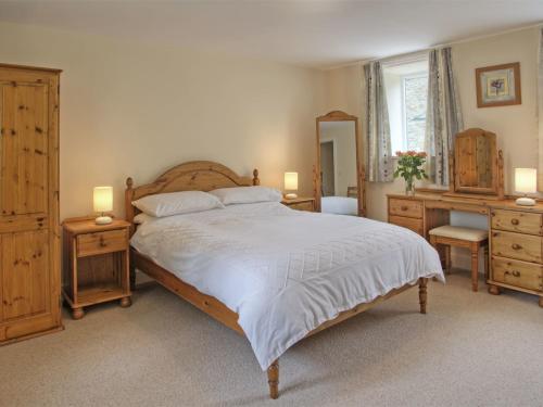 a bedroom with a bed and a dresser and a mirror at 2 Bed in Rowlands Gill CN192 in Stanley