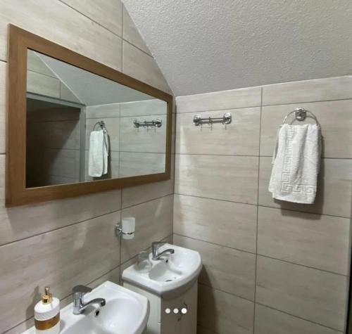 a bathroom with a sink and a mirror at Yugoslavija 2 centar in Aleksandrovac