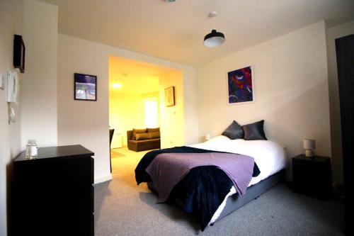 a bedroom with a bed and a living room at Convenience & Comfort - 1Bed Apt in Heywood in Heywood