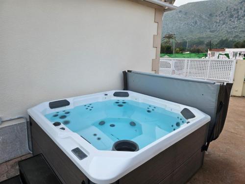 a jacuzzi tub sitting on a balcony at Villa Nelly in Alcudia