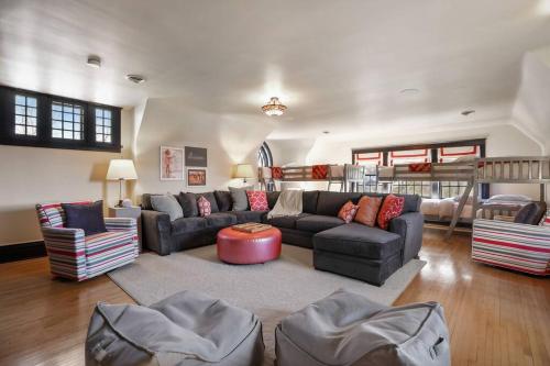 a living room with a couch and a table at Luxury 6600 sq.ft Stunning Home/Sleeps 10+ in Minneapolis