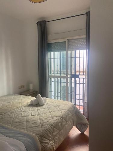 A bed or beds in a room at Apartamento Plaza de la Alfalfa