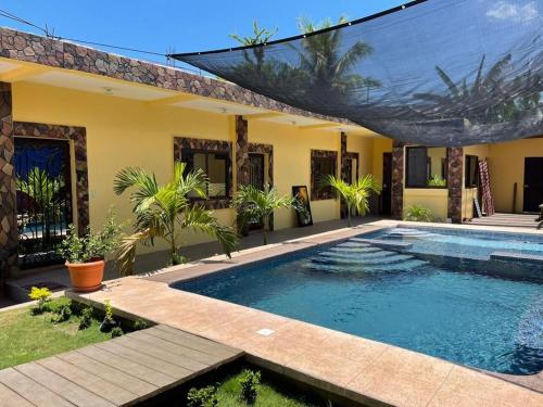 a swimming pool in the backyard of a house at Puerto Vallarta casas vacacionales in San José de Guatemala