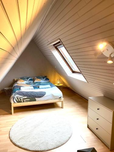 Säng eller sängar i ett rum på le duplex