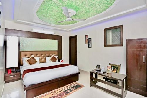 Una cama o camas en una habitación de Hotel Blossom Family Rooms
