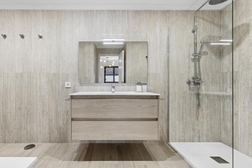a bathroom with a sink and a shower at Casahost Guenia Beach Apartment in Arrecife