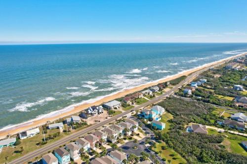 an aerial view of a beach with houses and the ocean at Sunset Inlet Luxury Oasis Flagler Beach in Flagler Beach