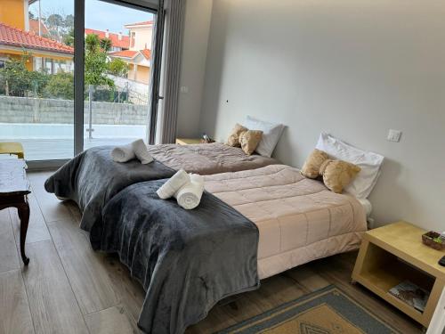 Ένα ή περισσότερα κρεβάτια σε δωμάτιο στο MIRANDA HOUSE