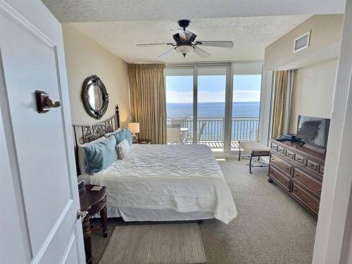 a bedroom with a bed and a view of the ocean at 4 Bedroom Luxury High Rise Corner Condo with 2 Balconies, Heated Pool, Direct Beach Access in Gulf Shores