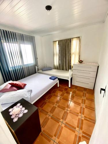 Ένα ή περισσότερα κρεβάτια σε δωμάτιο στο Pousada São Miguel Torres