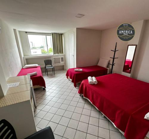 Hotel América Praiaにあるベッド