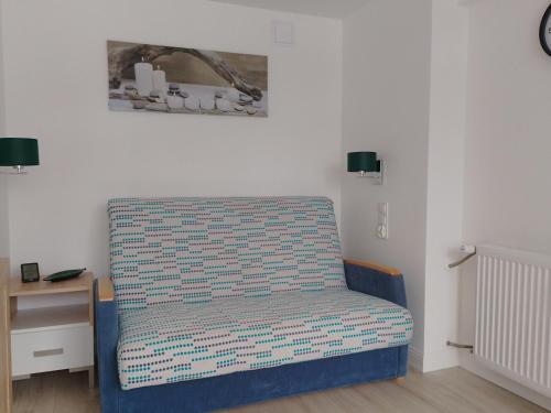 Una cama o camas en una habitación de Apartament Alias