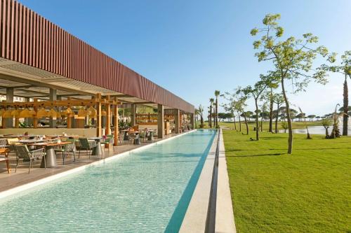 an external view of a resort with a swimming pool at Cullinan Belek in Belek