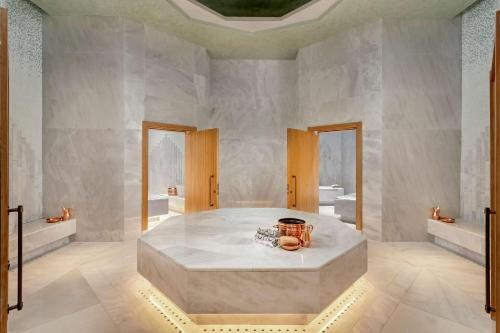 a large bathroom with a large tub in a room at Cullinan Belek in Belek
