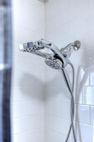 a shower with a shower head in a bathroom at Southern Charm in Columbus