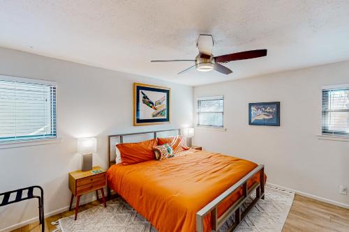 a bedroom with a bed and a ceiling fan at Mid-Century Memories in Lubbock