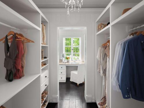 a walk in closet with a desk and a window at Sugar Beach, A Viceroy Resort in Soufrière