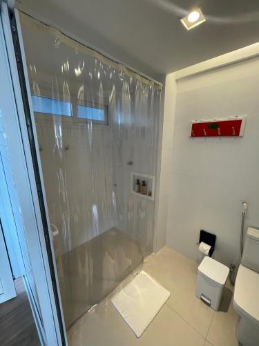 a bathroom with a shower and a toilet at Pousada Mar em Mim in Fernando de Noronha