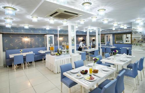 En restaurant eller et andet spisested på Eterno Hotel