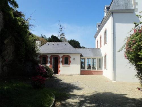 a large white house with a driveway at Résidence -pleneuf Val Andre - Maisons & Villas 694 in Pléneuf-Val-André