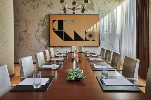 a conference room with a long table and chairs at Viceroy Chicago in Chicago