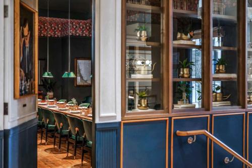 a dining room with a long table and chairs at Viceroy Chicago in Chicago