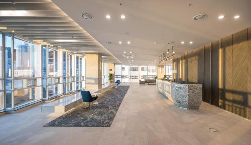 an office with a lobby with large windows at Grab The Ocean Songdo in Busan