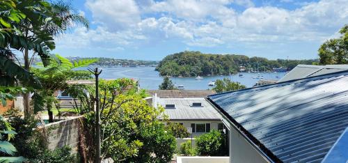 a view of a river from a house at Harbourside Escape: Sunlit Outdoor Terrace & Views in Sydney