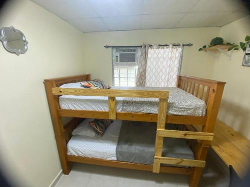 a bedroom with two bunk beds in a room at Cozy & comfy house in La Chorrera