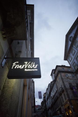 a sign on the side of a building at Hotel Carris Porto Ribeira in Porto