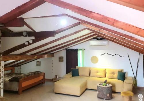 a living room with a couch in a attic at Apartments with parking space Bunica, Senj - 22142 in Senj