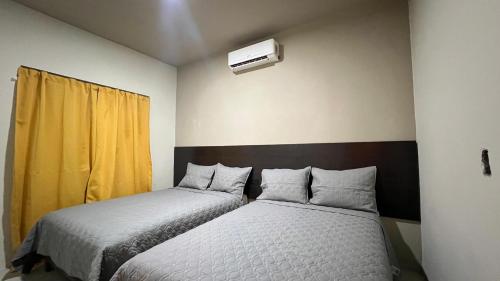 Postel nebo postele na pokoji v ubytování Hotelito s