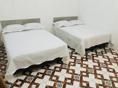 Llit o llits en una habitació de Casarão de aluguel