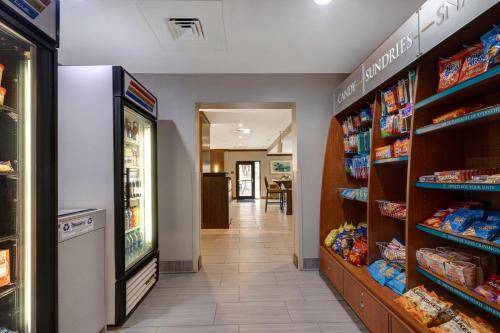 a grocery store aisle with shelves of food at Staybridge Suites Tallahassee I-10 East by IHG in Tallahassee