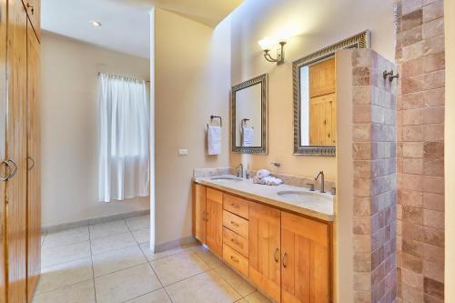 a bathroom with a sink and a mirror at Casa Robyn in Cabo San Lucas