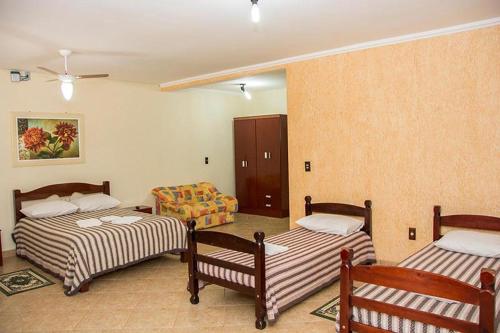 Uma cama ou camas num quarto em Hotel Fazenda Monte Sião