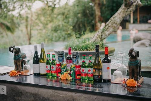 a group of bottles of wine sitting on a table at Bucu View Resort in Ubud