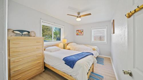 a bedroom with two beds and a window at Jacksonville Beach Home - Walk to Beach, Bars & Restaurants - Pet Friendly in Jacksonville Beach