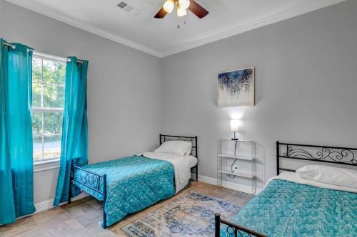 a bedroom with two beds and a window at Reduced! Renovated hidden gem. Chef Kitch. Wheelch in Beaumont