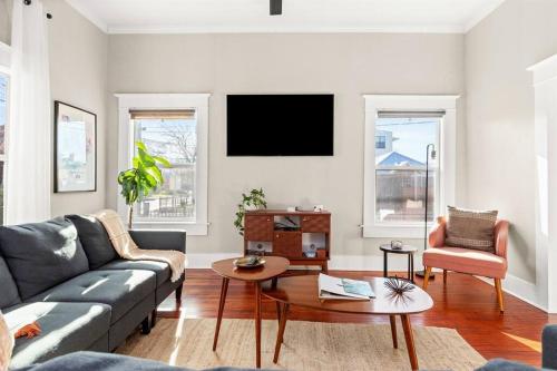 a living room with a couch and a table at Reduced! Casa Paz - Historic Home Walking Distance in San Antonio