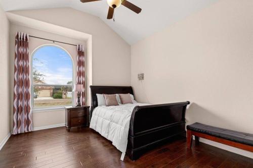 a bedroom with a large bed and a window at Reduced! Randolph Central, 1-story, Chef Kitchen in Selma