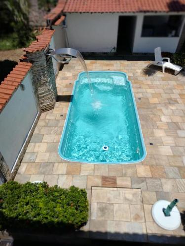 Πισίνα στο ή κοντά στο Casa confortável com piscina