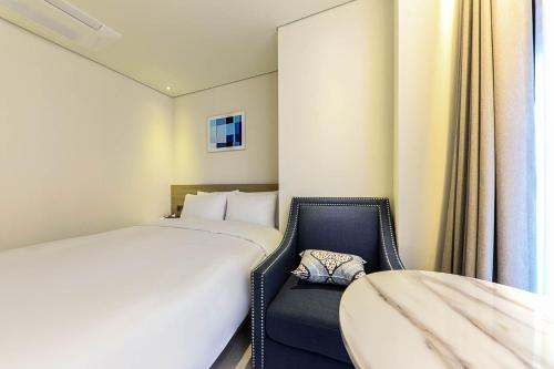 Un ou plusieurs lits dans un hébergement de l'établissement Ocean 2Heaven Hotel Busan