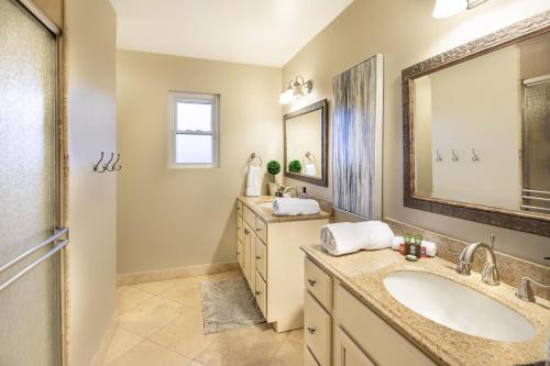 a bathroom with a sink and a mirror at Scottsdale Vacation Rentals in Scottsdale